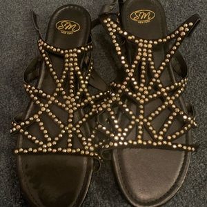 Black and gold sandals
